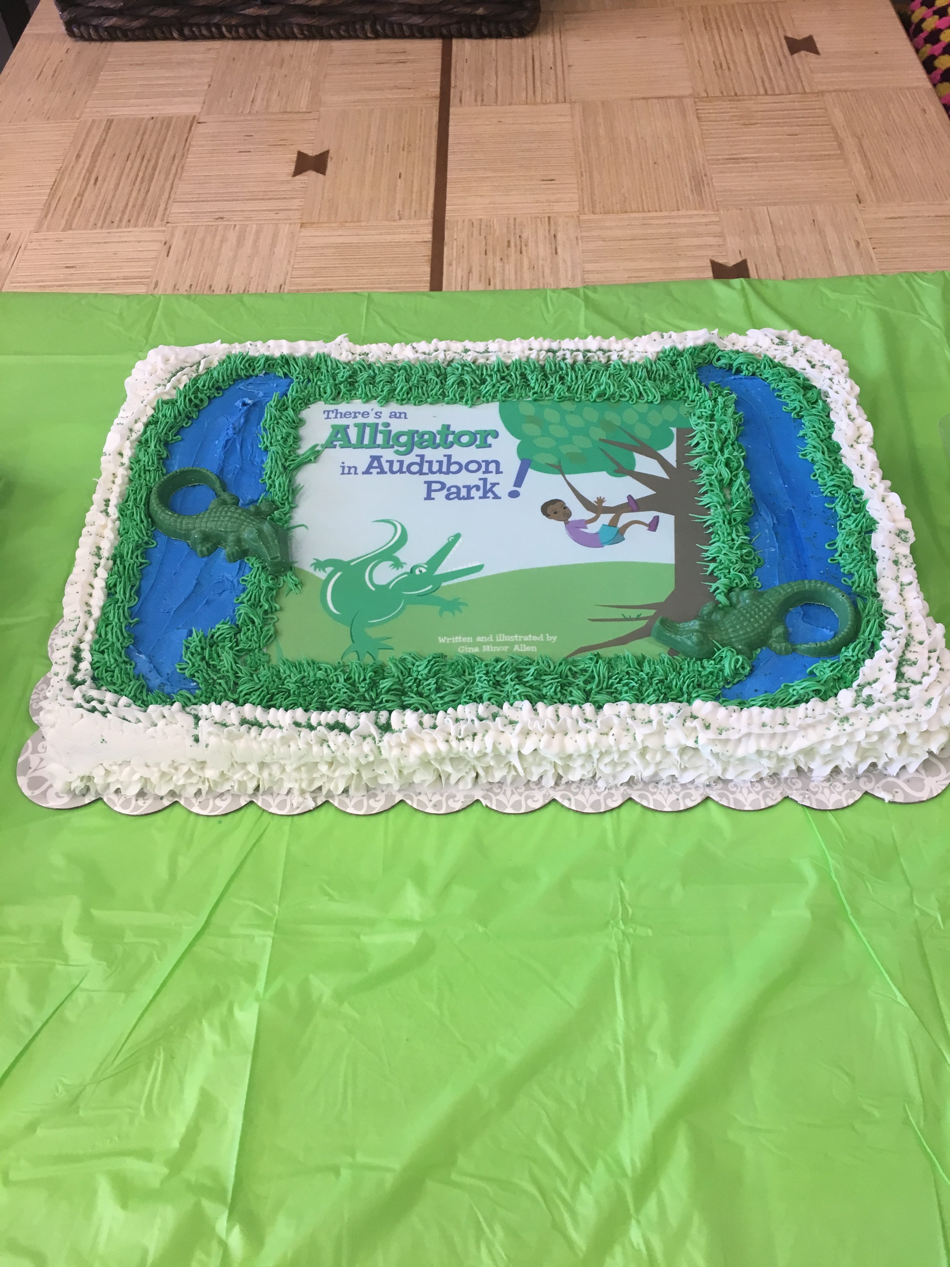 Cake featuring the book cover of "There's An Alligator in Audubon Park!"